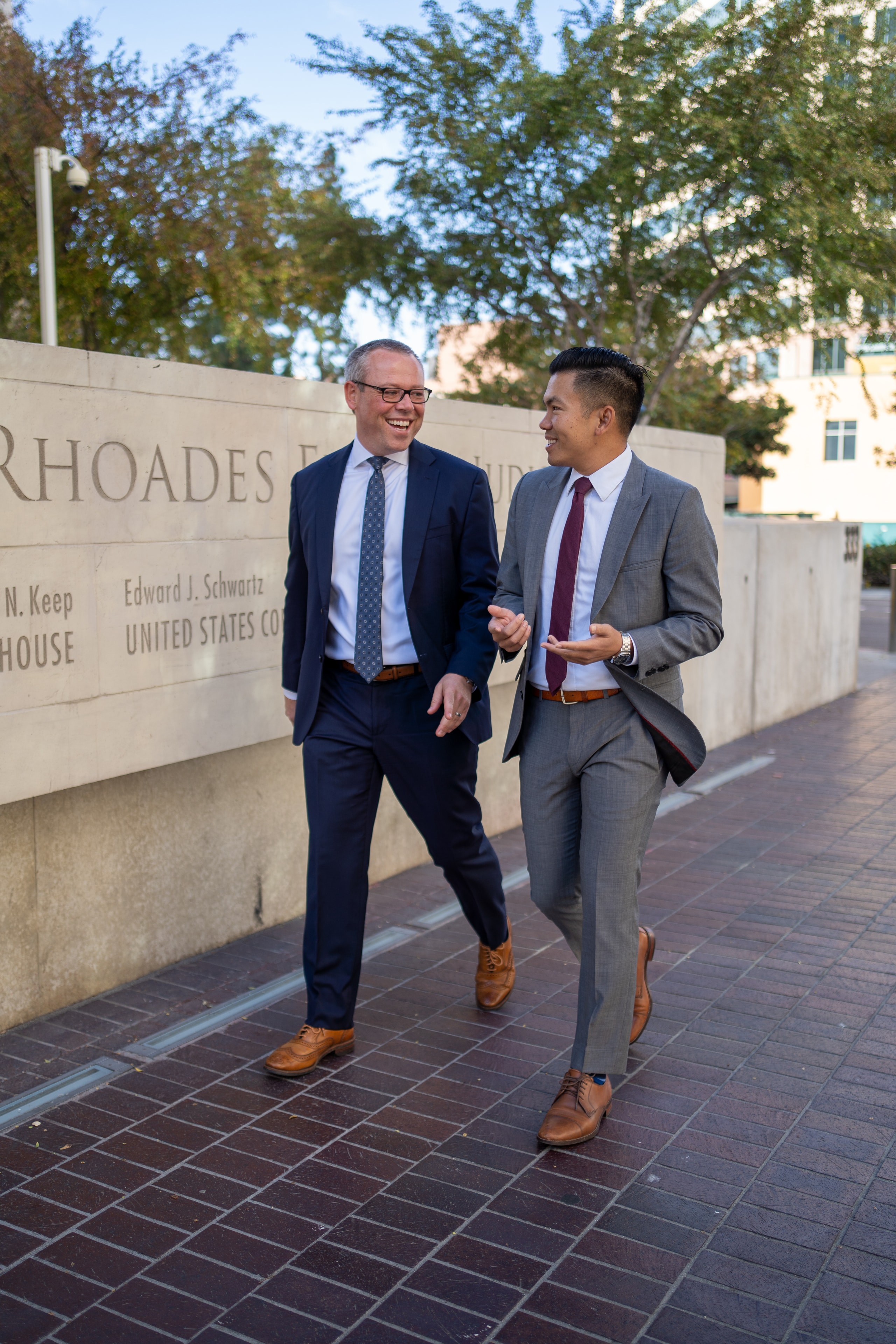 Ryan Stitt and Tommy Vu walking outside the courthouse